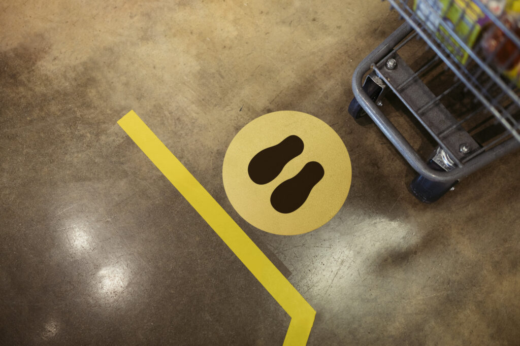 Social distancing floor marker in a store, part of crowd management planning