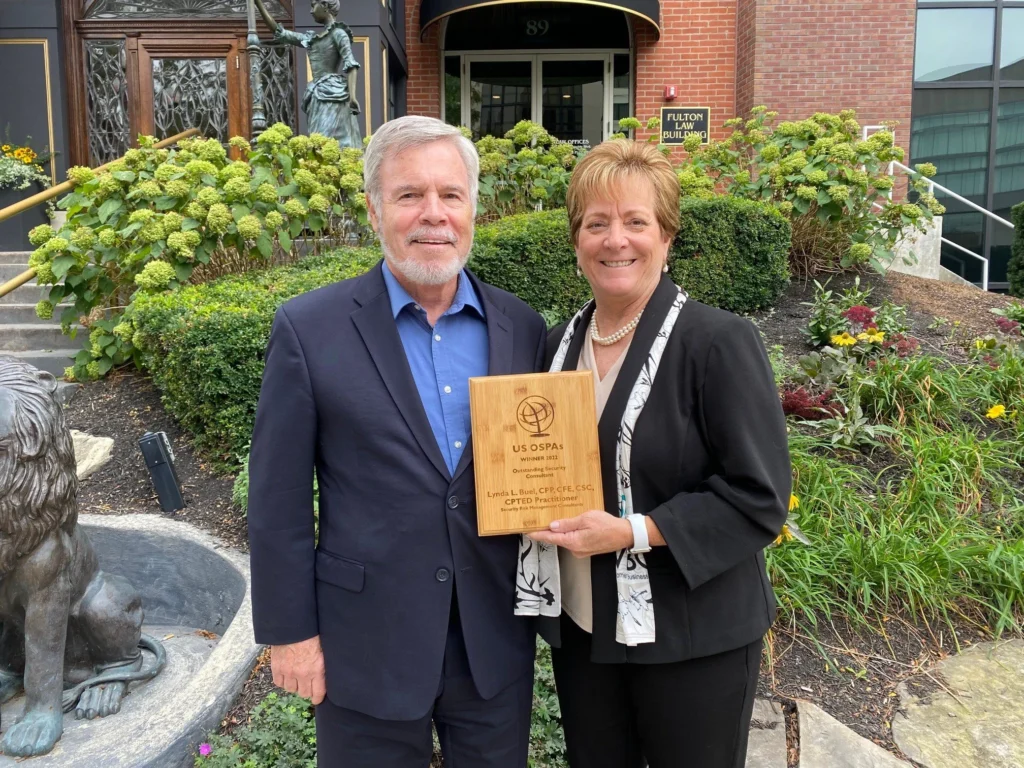 Lynda L. Buel of SRMC with the 2022 US Outstanding Security Performance Award (OSPA) plaque